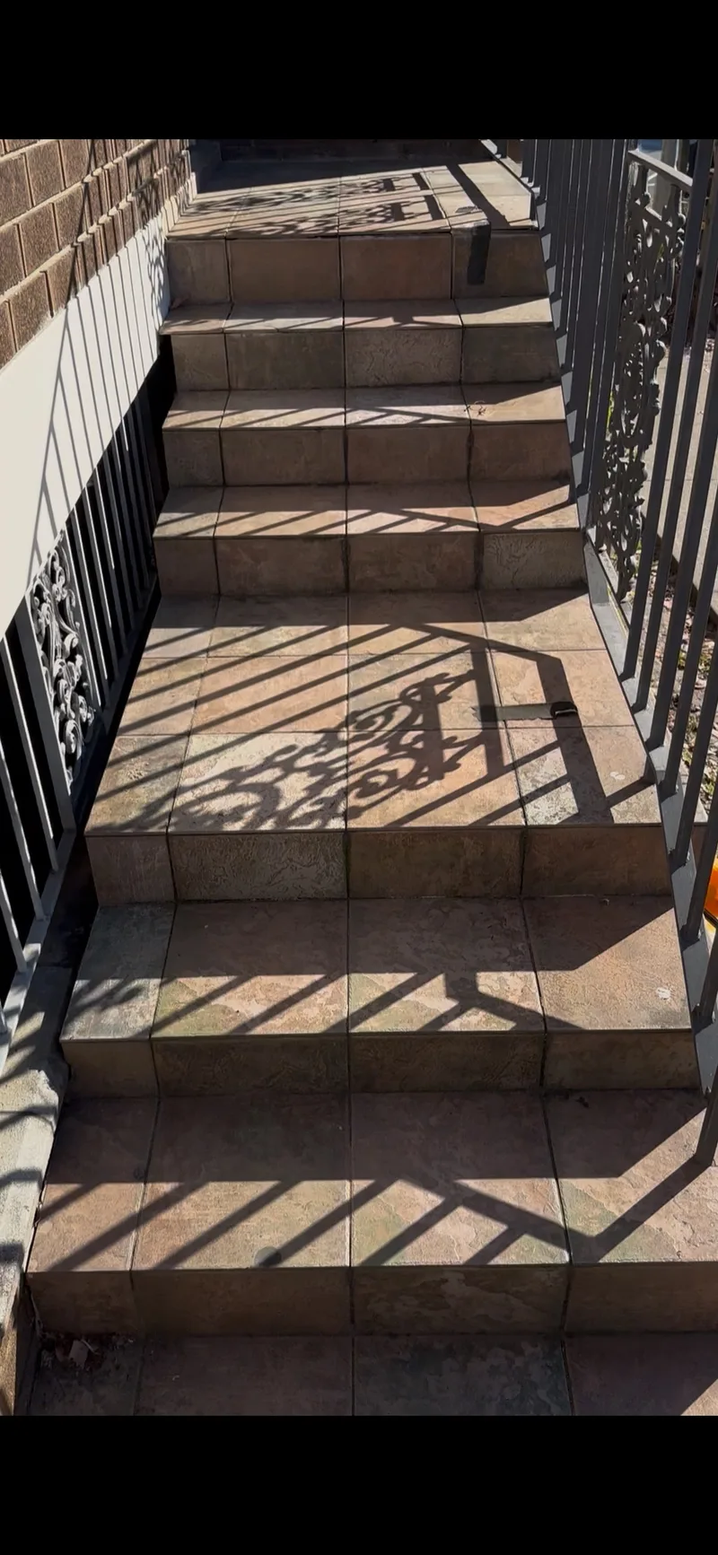 Exterior tiled stairs and landings in Epping before the completed tiling work.