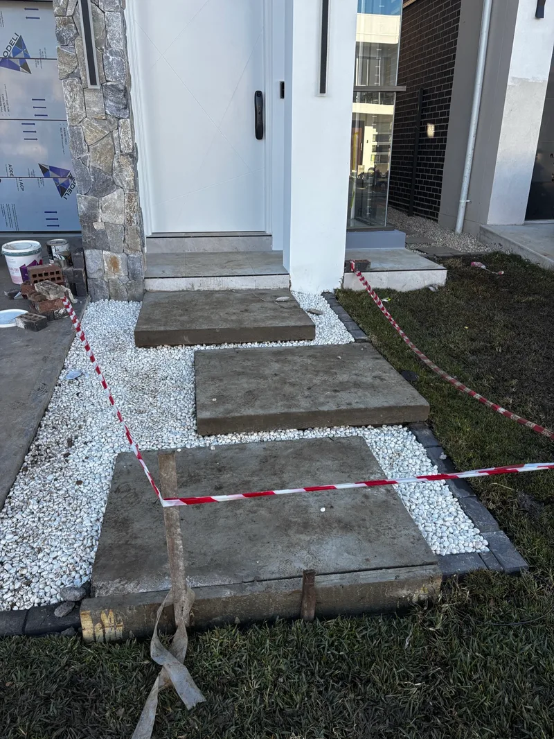 Floating entry stairs in Marsden Park before the completed tiling work.