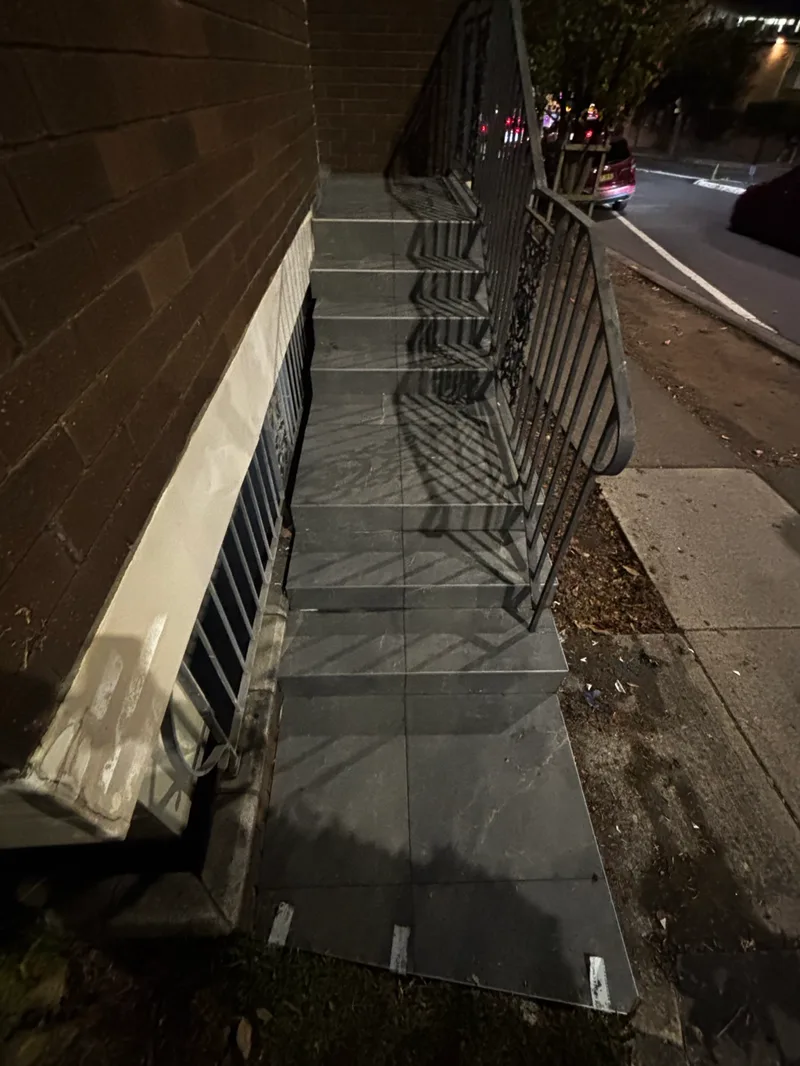 Exterior stairs and landings in Epping after the completed tiling work.