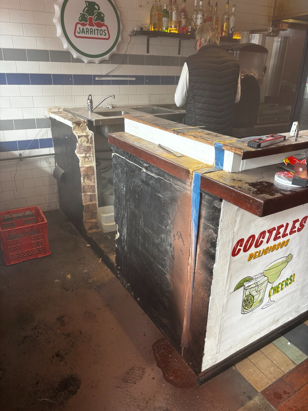 Existing brick wall, sink and counter before commercial demolition in Newtown.