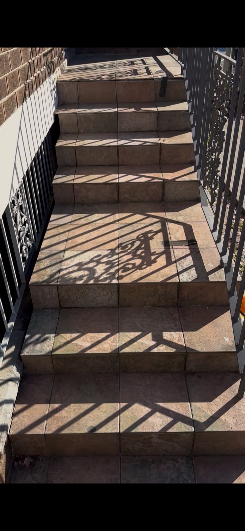 Exterior tiled stairs and landings in Epping before the completed tiling work.
